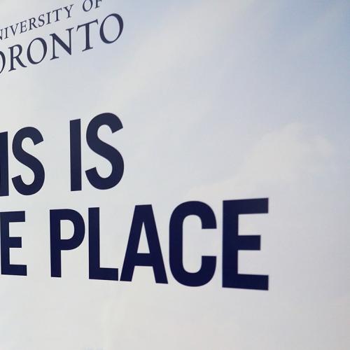 A sign shows the words This is the Place under the University of Toronto logo.