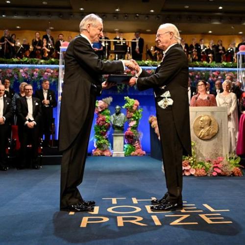 Geoffrey Hinton on stage receiving the Nobel Prize