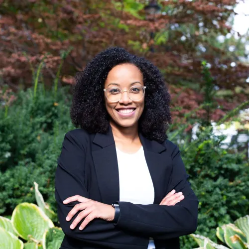Portrait of Juliana Nunes da Silva standing outdoors
