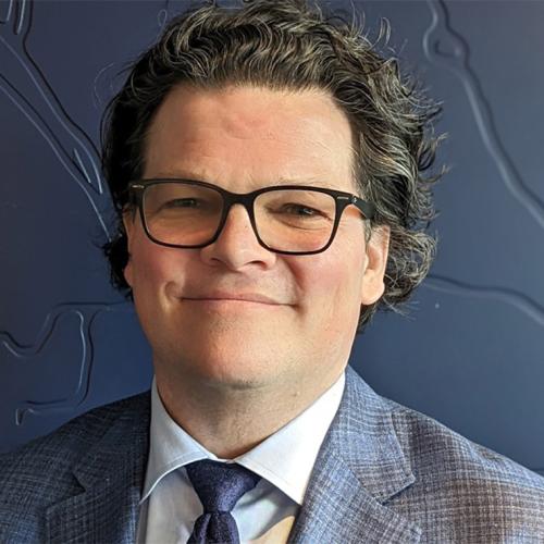 Portrait of Colin McKay smiling.