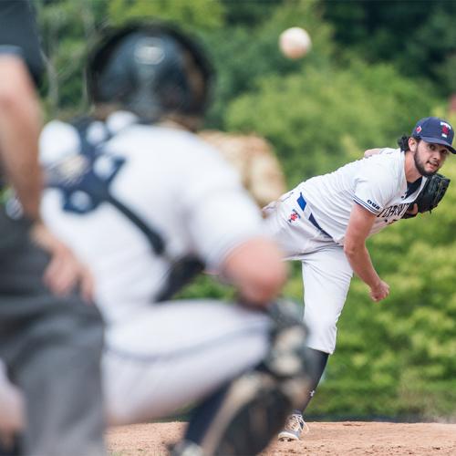 Conall Helverson pitches a baseball directly at a waiting catcher.