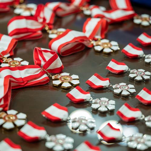 Order of Canada medals laying flat on a table