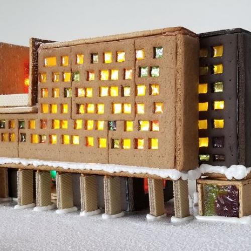 New College built from gingerbread features glowing sugar windows, wafer pillars, and snow icing.