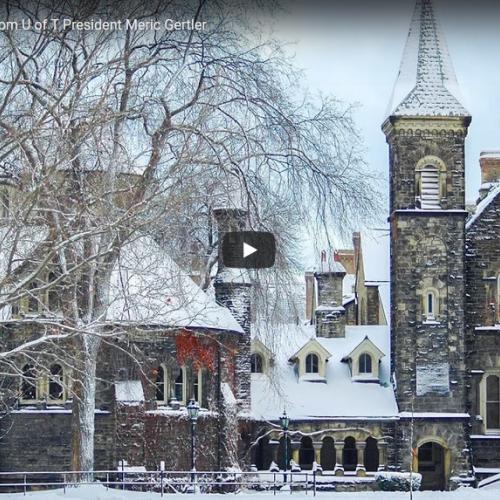 Snow lies on roofs and tree branches outside Croft Chapter House in this still from the holiday video.