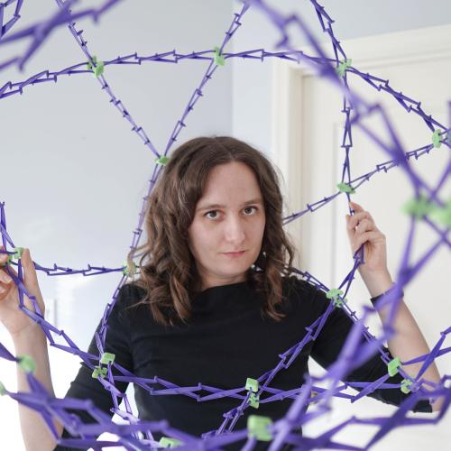 Kelly Lepo inside a bunch of purple wires
