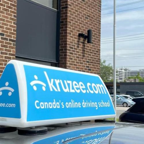 The top of a car with a Kruzee sign on its roof