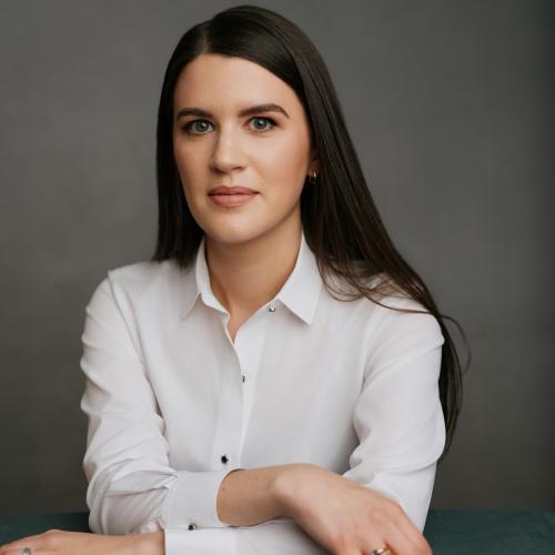 A portrait of a person in a white dress shirt 