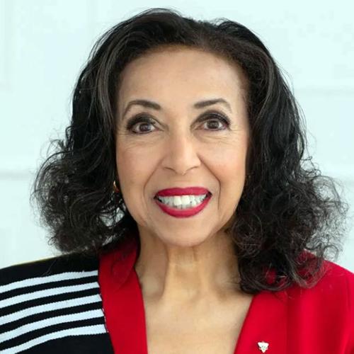 Portrait or Rosemary Sadlier in a red jacket