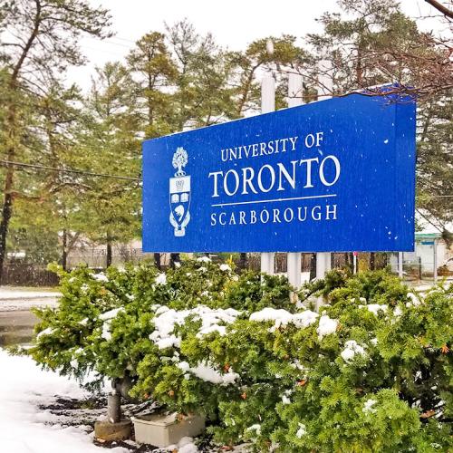 Freshly fallen snow lies around the University of Toronto Scarborough sign.