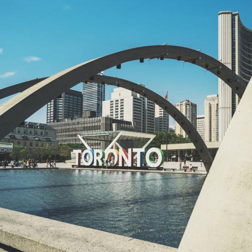 A sign reading "Toronto" at Toronto City Hall. (photo by Scott Webb via Unsplash) 