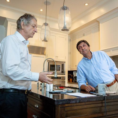 University Professor Emeritus Geoffrey Hinton and U of T President Emeritus Dr. David Naylor discuss the transformative impact of AI on health care in the kitchen of Naylor's Toronto home (photo by Lisa Lightbourn) 