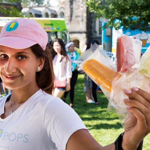 Leila Keshavjee (BKin 2016), who landed a $150,000 deal on CBC's Dragons' Den, shows off her ice pops during U of T's clubs day (photo by Chris Sorensen) 