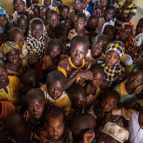 A group of children in their classroom in the village of Kpalong, 50 kilometres outside Tamale in northern Ghana (photo by Marcus Valance/SOPA Images/LightRocket via Getty Images) 