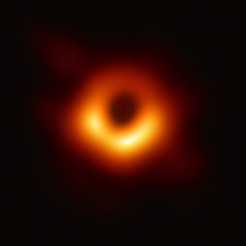 The black hole looks like a dark circle surrounded by a glowing donut of light, brighter on one side.  (photo courtesy of U.S. National Science Foundation) 