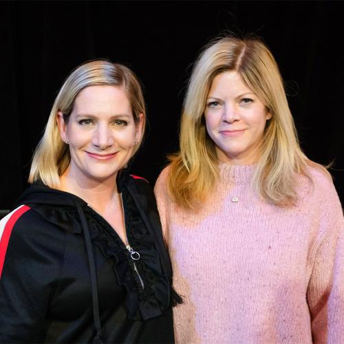 Sisters Erika and Stephanie Savage smile as they pose together for a picture.