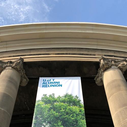 Banners draped between pillars at Convocation Hall welcome U of T graduates and guests back to campus. Photo by Kimberly Lyn.