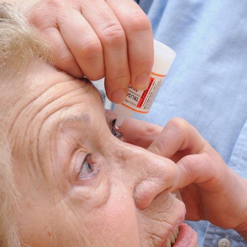 A nurse in France administers an anti-glaucoma agent to a patient (photo by BSIP/UIG via Getty Images) 