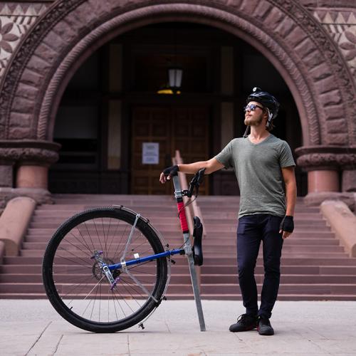 Taylor Stark, a U of T alumnus who is returning for a master's degree in classics, rode his unicycle "Caroline" from Vancouver to Toronto (photo by Geoffrey Vendeville) 