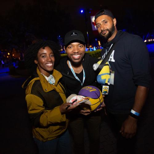 Three alumni smiling together at Canada's Wonderland.