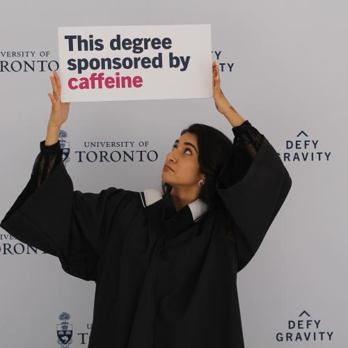Person holding photo booth prop