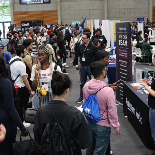 A group of UTM new grads engaging with companies reps at the 2024 Get Hired Fair