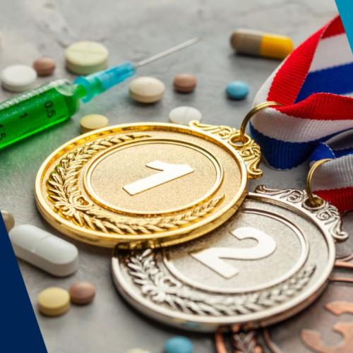 Image of an injection, pills and gold, silver and bronze medals
