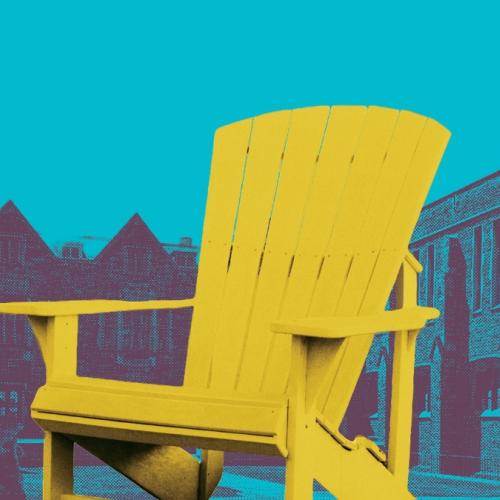 Brightly coloured Muskoka chair in the middle of the Hart House Quadrangle.