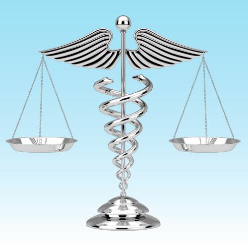 Medical symbol with balanced scales