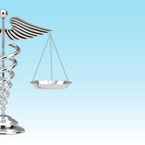 Medical symbol with balanced scales