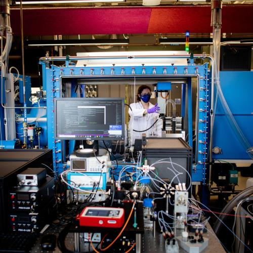 Image of researcher in a lab with computers