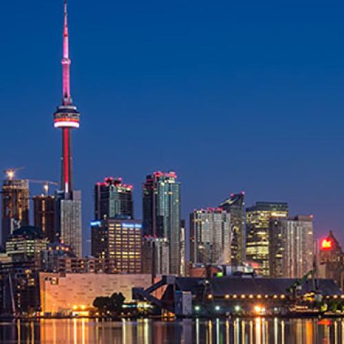 Photo of the Toronto skyline at night, including the CN Tower