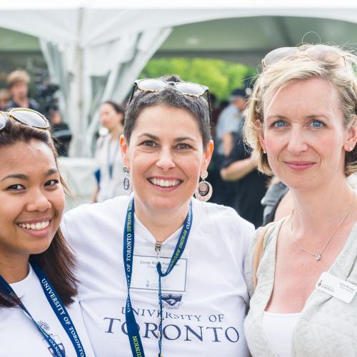 Three Alumni standing together smiling at the U of T Alumni Association