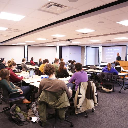Photo of alumni in a classroom