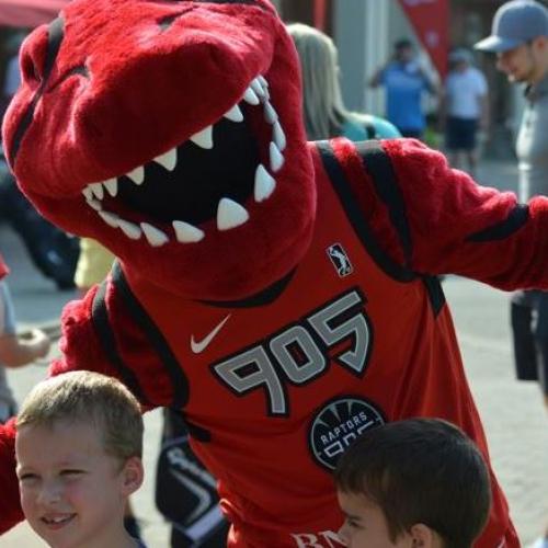 Raptors 905 mascot posing with kids