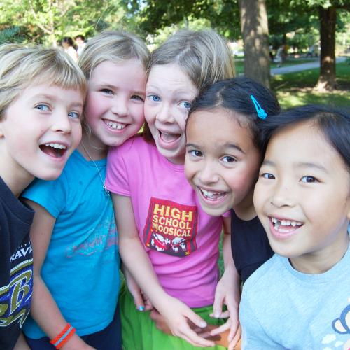 5 kids smiling.