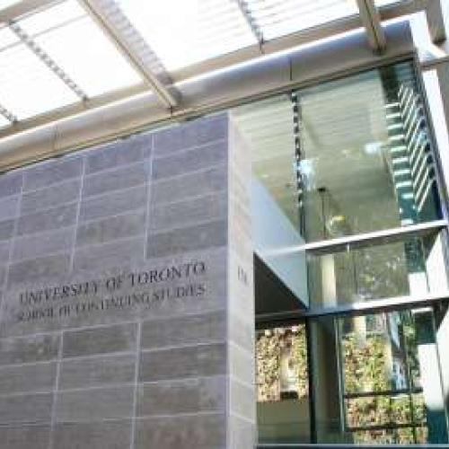 Exterior picture of the School of Continuing Studies - An angular building with grey, flat stones