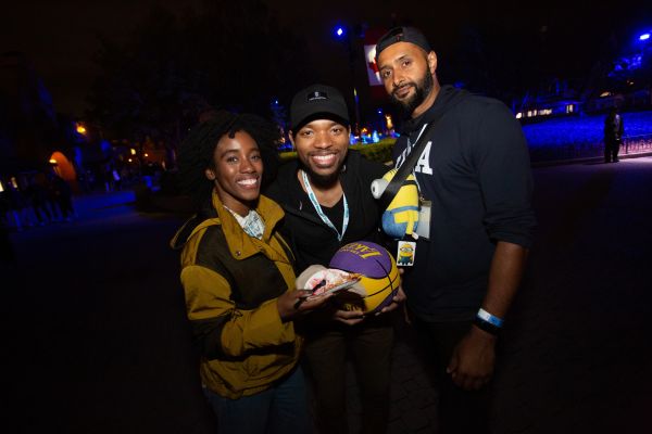 Three alumni smiling together at Canada's Wonderland.